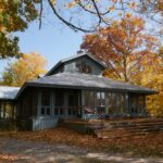 Queens University Biological Station main building surrounded by Fall leaves and trees